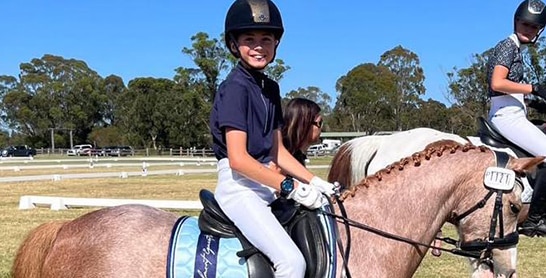 Young Boy Riding a Horse — Holistic Animal Physiotherapy in Medowie NSW
